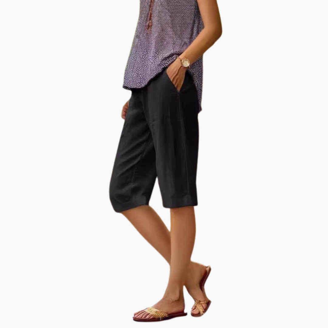 Side view of relaxed fit linen shorts on model
