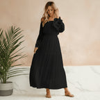 Woman wearing dress at three-quarter angle, full length view