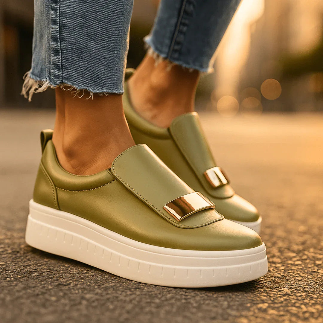 Model wearing black platform loafers, side profile standing pose