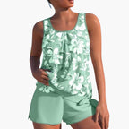 Model in floral tankini set, relaxed poolside pose