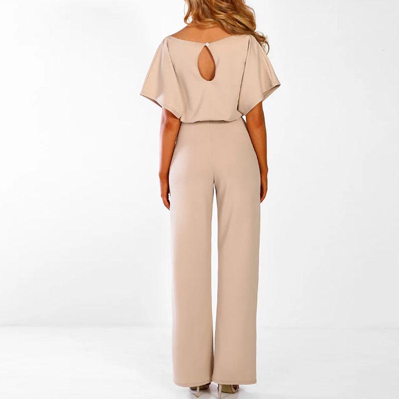 Model wearing the set from front, showing short sleeve top and high-waisted trousers
