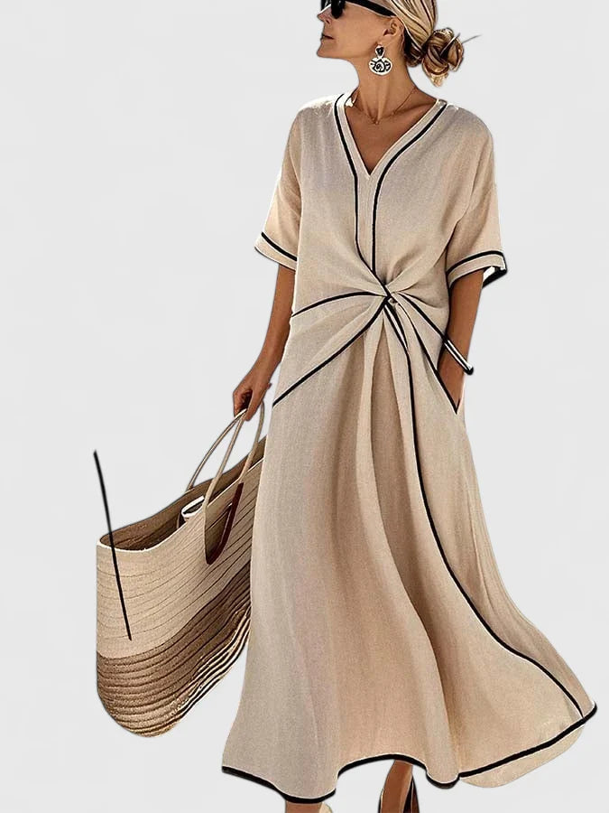 Side angle displaying flowing maxi skirt and contrast hem detail