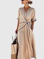 Close-up of contrast trim detailing on v-neckline and sleeve