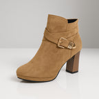 Model wearing suede ankle boots in evening outfit