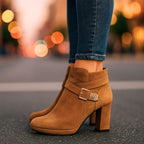 Model in office wear styling beige suede ankle boots