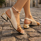 Woman walking in beige and green slingback heels, outdoor setting