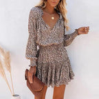Side angle of leopard print dress showing empire waist and flowing fabric