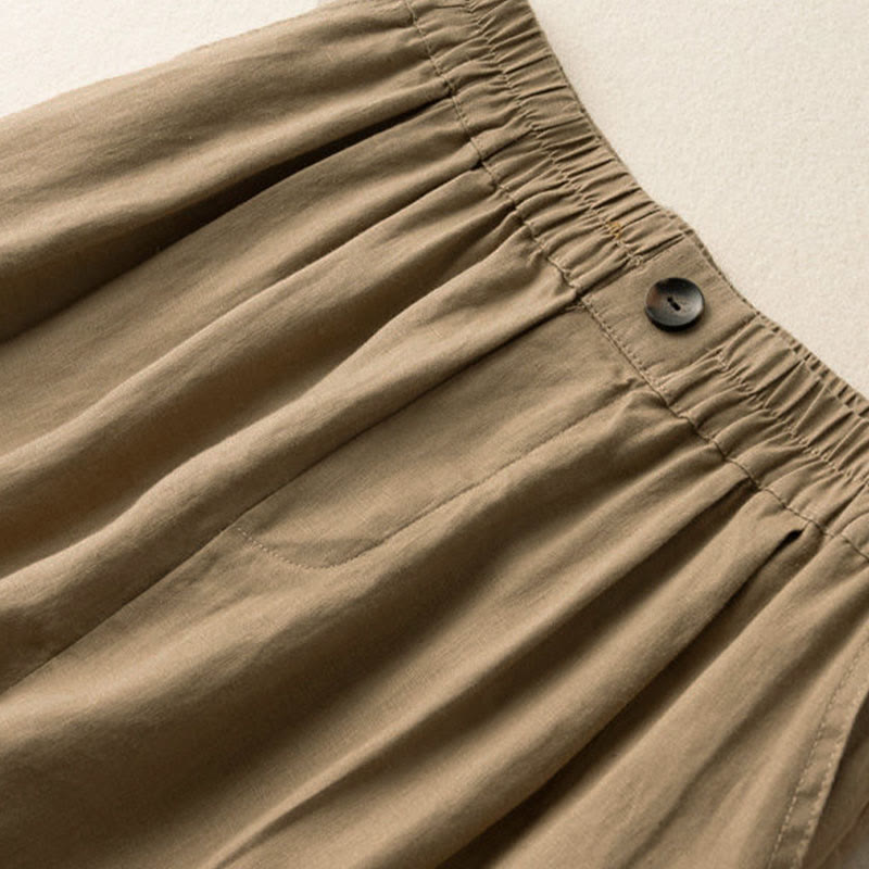 Model wearing linen shorts, standing pose showing full length silhouette