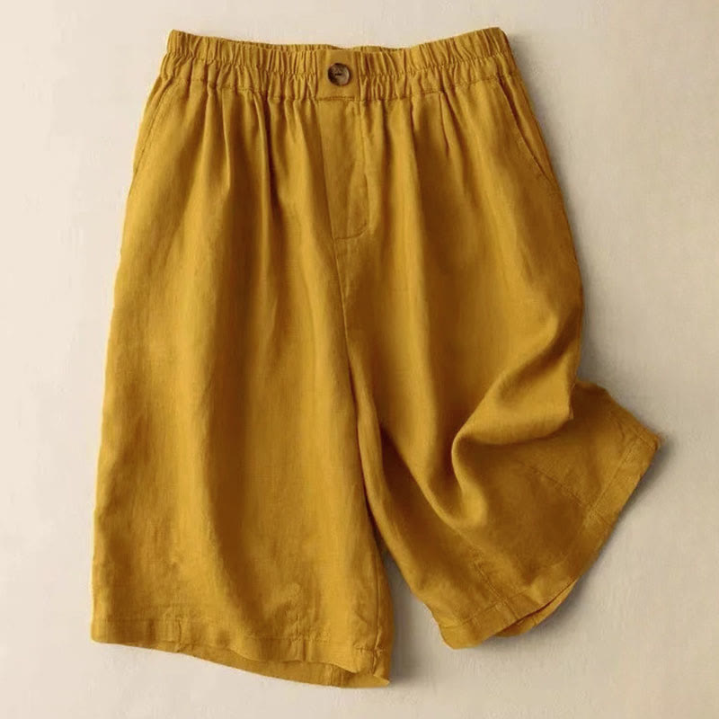 Side view of woman in linen shorts demonstrating wide leg fit