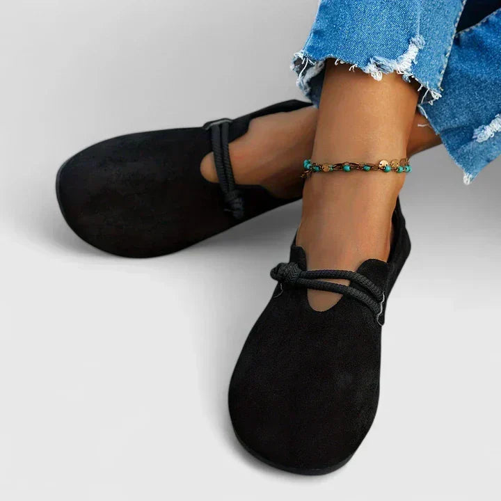 Close-up detail of rope strap accent on loafer upper