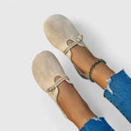 Beige loafer from above displaying cushioned footbed and sole