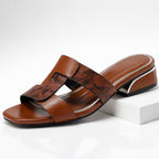 Woman wearing mule sandal while standing, full side view