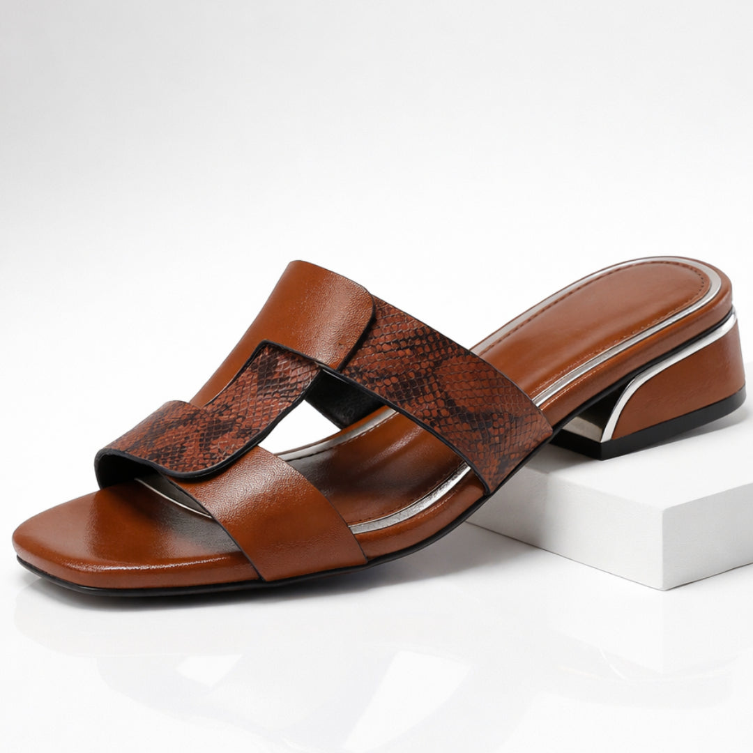 Woman wearing mule sandal while standing, full side view