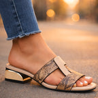 Women's snake print leather mule sandal displayed on white background