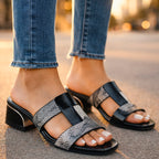 Woman wearing matching pair of mule sandals while standing