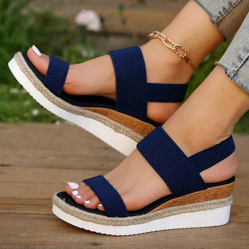 Pair of beige platform espadrilles displayed flat lay