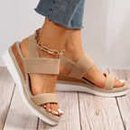 Women's beige platform espadrille sandals with elastic straps, front view