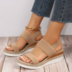 Model wearing stretch strap platform sandals, standing pose