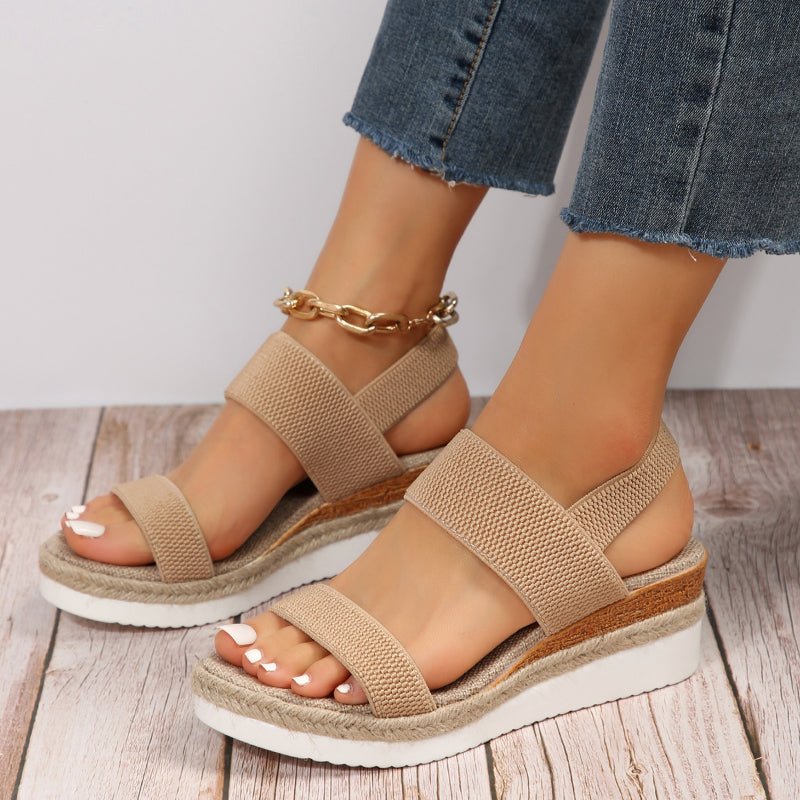 Model wearing stretch strap platform sandals, standing pose