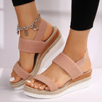 Top-down view of platform sandal showing elastic strap fit across foot