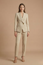 Woman wearing shawl lapel blazer and straight-leg trousers, front facing pose