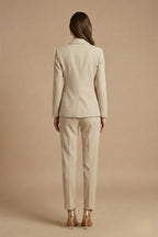 Side profile view of tailored blazer with gold-tone buttons and structured fit