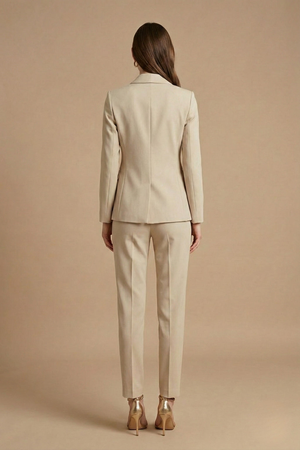 Side profile view of tailored blazer with gold-tone buttons and structured fit