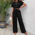 Detail of drawstring waist adjustment on trousers
