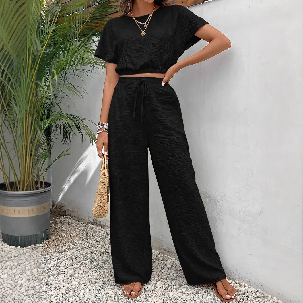 Detail of drawstring waist adjustment on trousers
