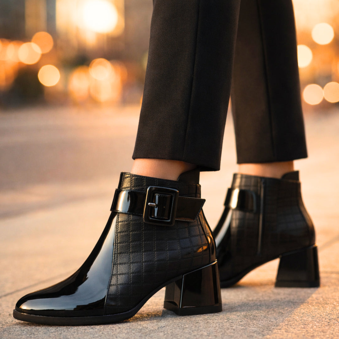 Close-up of oversized buckle ankle wrap on boot