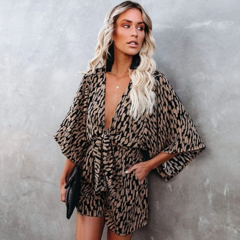Close-up detail of animal print fabric and V-neckline on romper