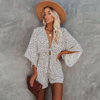 Detail shot of wide leg shorts and flared sleeve cuffs on romper