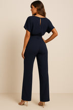 Model walking in jumpsuit showing movement and comfort