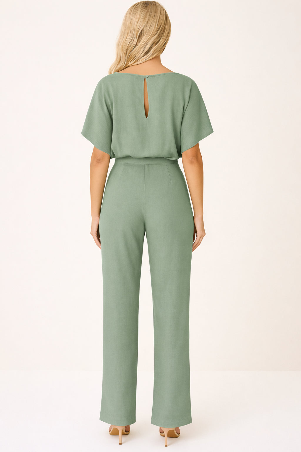 Jumpsuit laid flat on surface showing overall construction