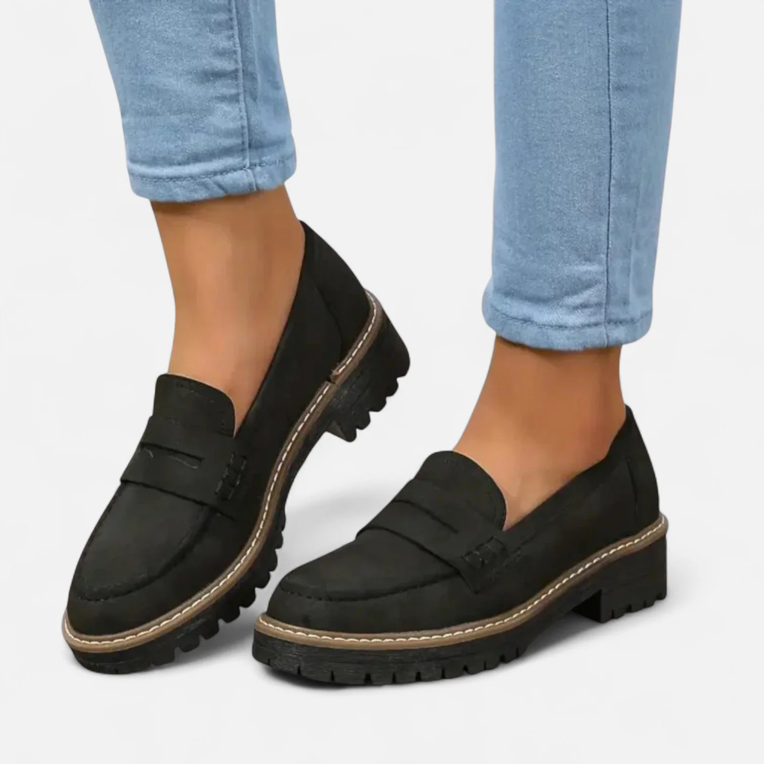 Black chunky sole loafer shown from the side