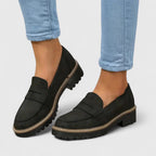 Black chunky sole loafers with penny strap, front view