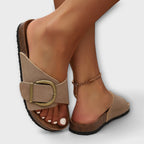 Model wearing sandals, walking pose