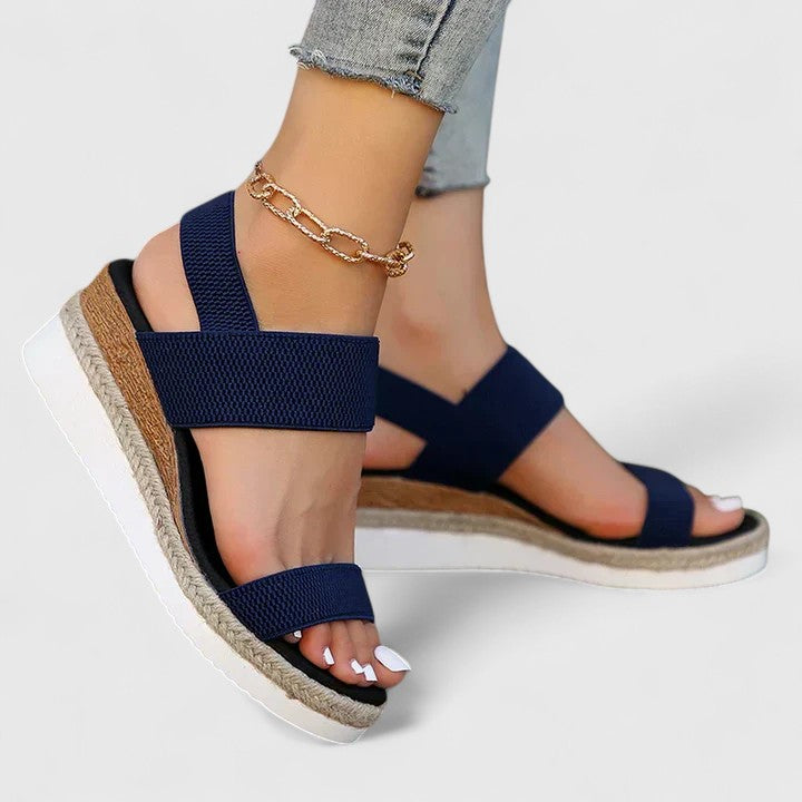 Pair of black espadrille sandals shown together, flat lay