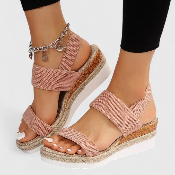 Back view of woman wearing black platform sandals