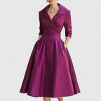 Close-up of v-neck neckline and 3/4 sleeve cuff detail