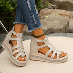 Woman in gladiator sandals, side-on walking pose