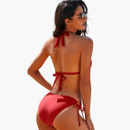 Back view of woman wearing black halter bikini set