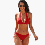 Woman in black bikini, side profile view