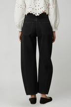 Close-up of black denim fabric texture and weave