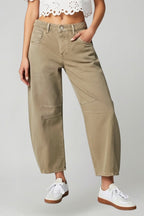 Waistband and button detail on high rise black jeans