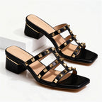 Studded mule sandal displayed on foot, three-quarter angle