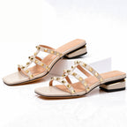 Square toe detail of black leather studded mule