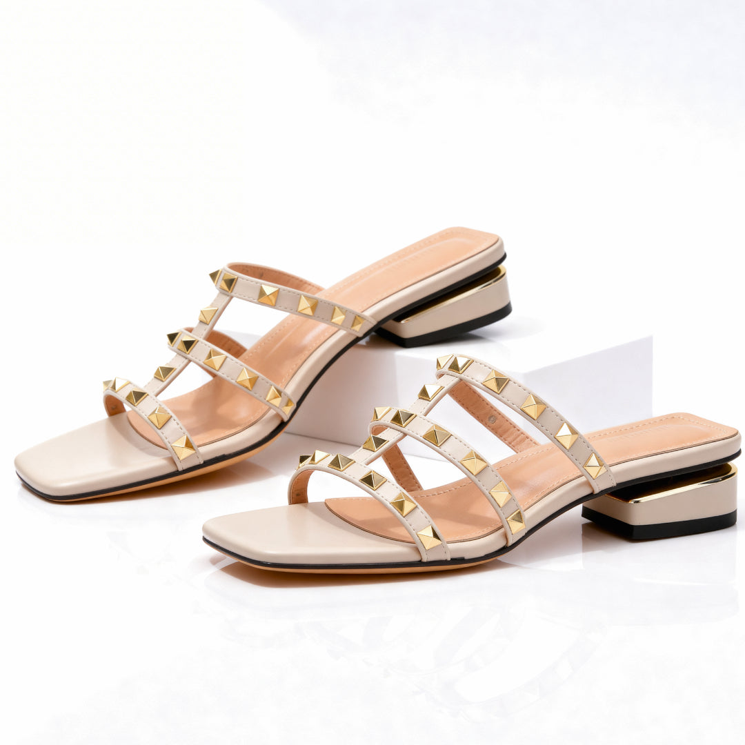 Square toe detail of black leather studded mule