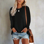 Women's long sleeve relaxed fit pocket top in neutral tone, front view