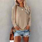 Close-up of functional side pocket detail on relaxed fit top